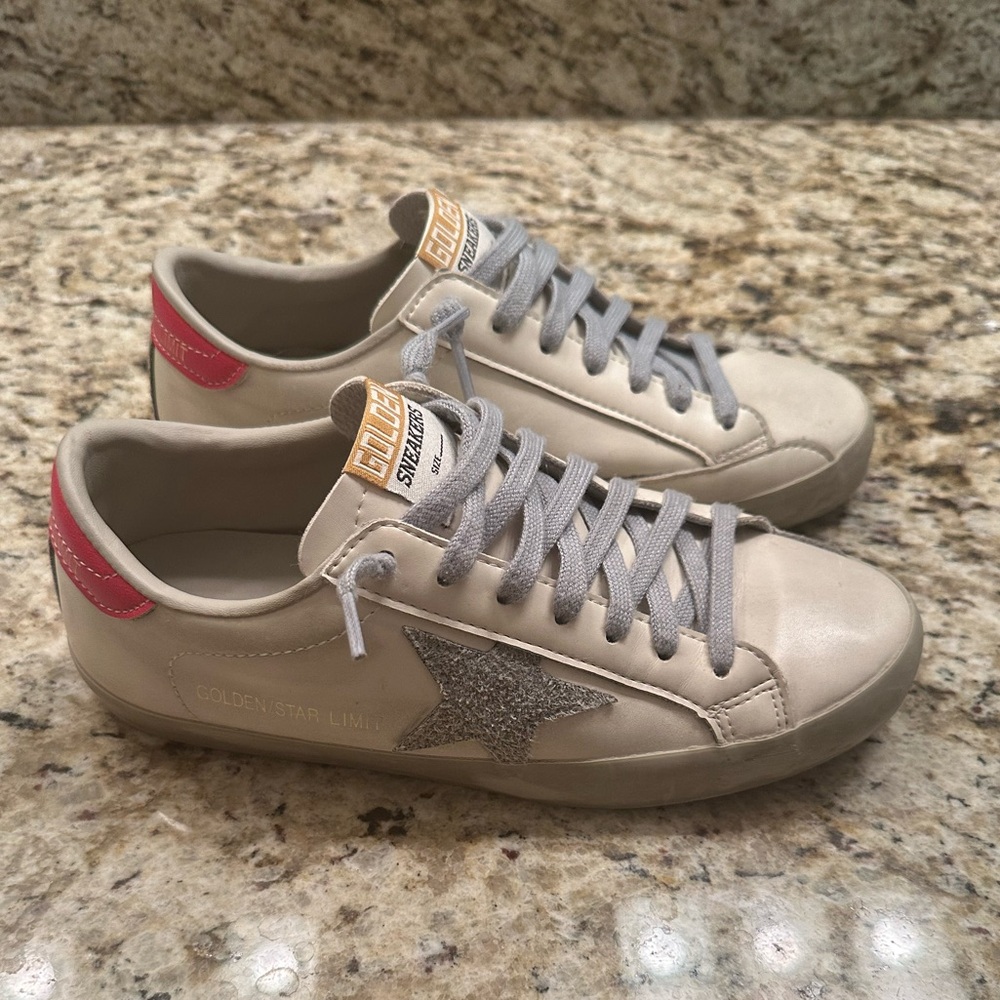 Golden distressed star sneakers